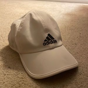 White/Grey Adidas hat with a velcro adjustable feature in the back.